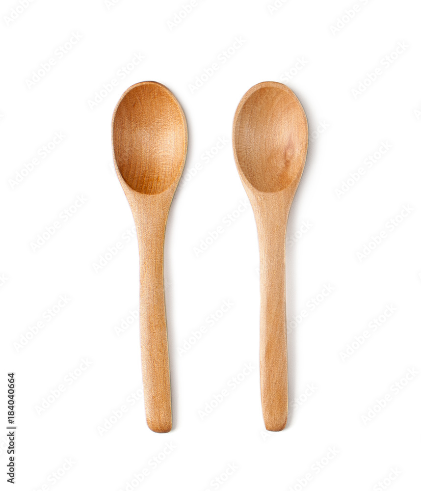 Two teaspoons of natural wood. Isolated on white background..