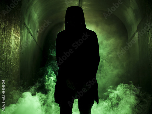 Photography Silhouette of a man in fog green light