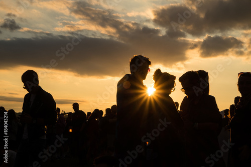 People at festival during summer sunset 