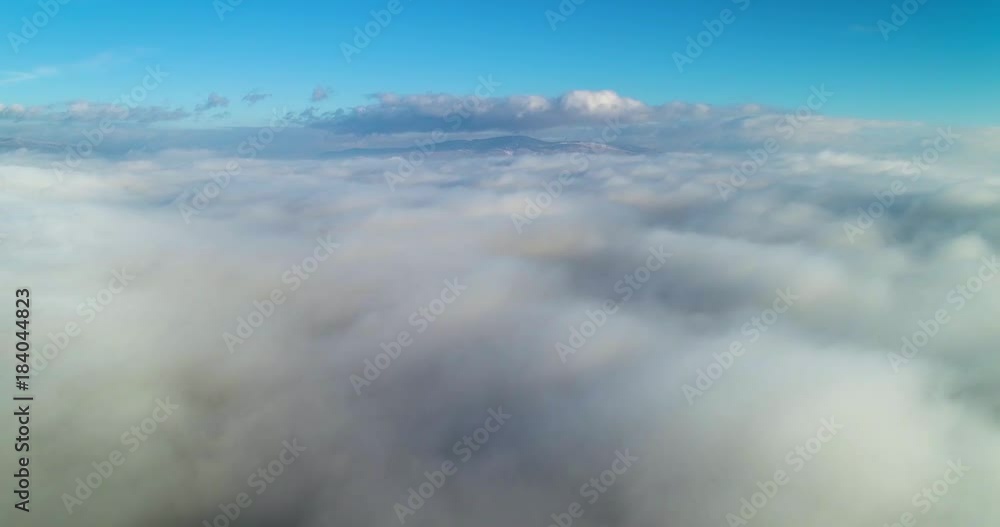 Aerial wiev: Amazing Flying over the Clouds of Fog, above the City Aerial wiev: Amazing Flying over the Clouds of Fog, above the City