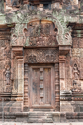 Banteay Srei, a 10th century Hindu temple dedicated to Shiva. The temple built in red sandstone was forgotten for centuries and rediscovered 1814 in the jungle of the Angkor area of Cambodia.  © rolf_52