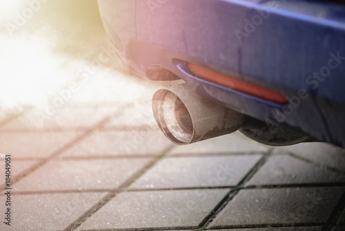 Car exhaust pipe system air pollution of traffic fumes. 
