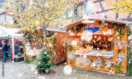 Christmas market under the snow in Eguisheim, Alsace, France