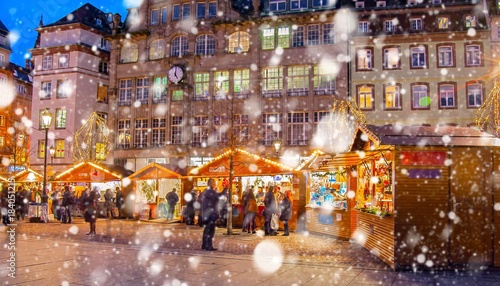 Christmas market under the snow in Strasbourg, Alsace, France