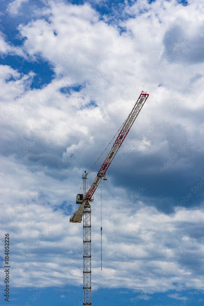 Hoisting crane against sky on the background Hoisting crane against sky on the background