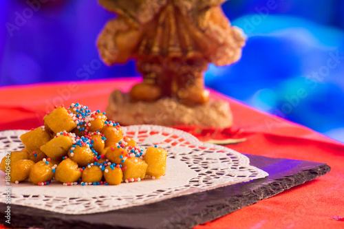 Close Up Of Italian Traditional Food Called Strufoli On Blur Colored Background photo