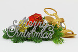 Merry Christmas written with sparkling letters and Christmas decorations on fresh pine
