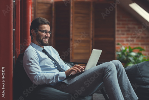 Smiling businessman in the loft