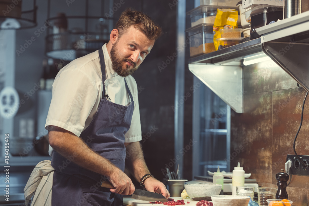 Fototapeta premium Man cooking indoors