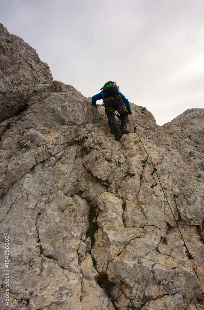 Climbing tourist on the via ferrata, Triglav National Park, Slovenia