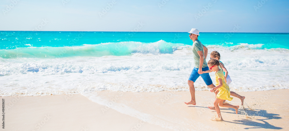 Family on white tropical beach on caribbean island Family on white tropical beach on caribbean island