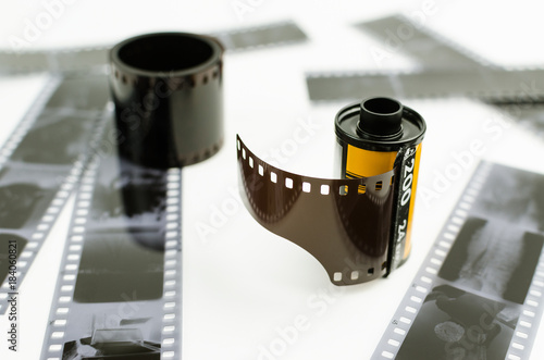 the roller 35 mm film on white background, black and white negatives