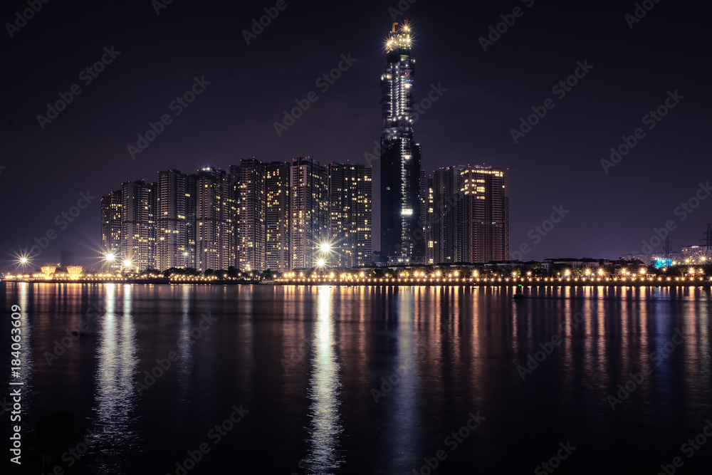 View of skyscrapers at night with many sparkling lights in Ho Chi Minh City, Vietnam