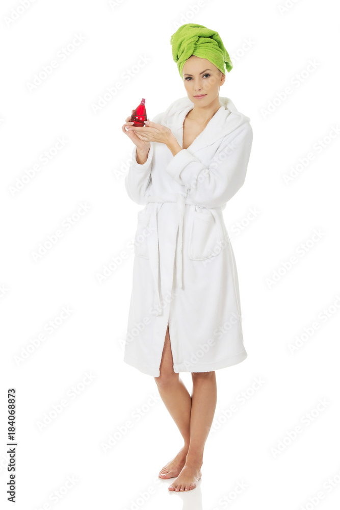 Beautiful woman with bottle of perfume. Beautiful woman with bottle of perfume.