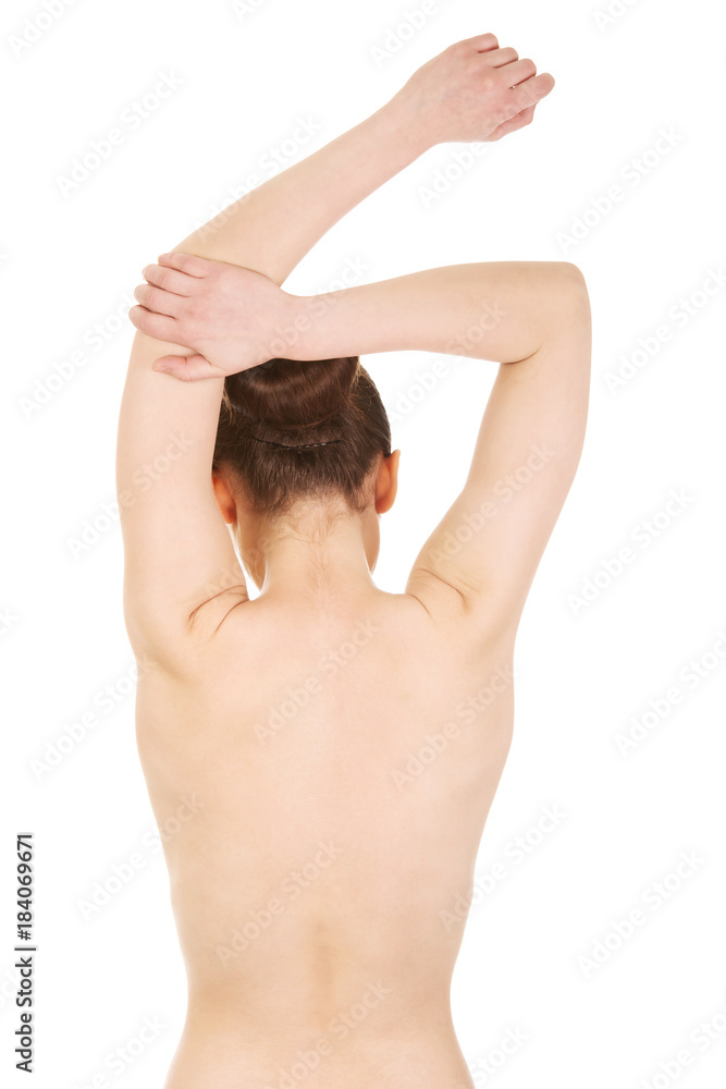 Rear view of topless woman with hands on lower back waist up - Stock Photo  - Masterfile - Premium Royalty-Free, Code: 640-01458754