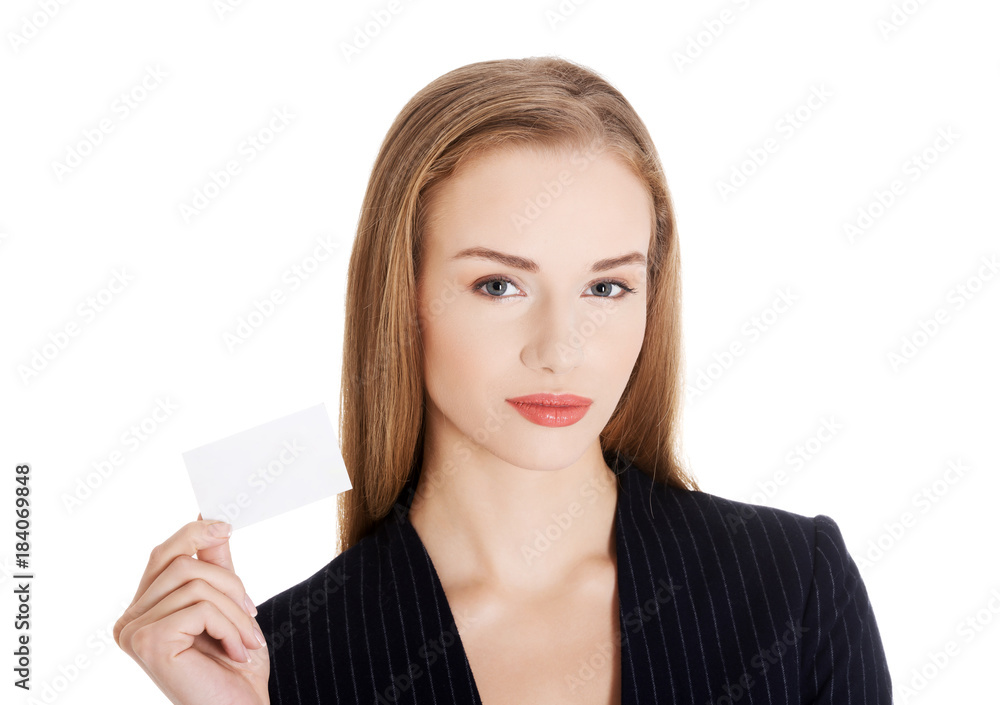 Beautiful business woman holding small empty personal card. Beautiful business woman holding small empty personal card.