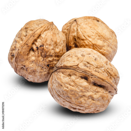 three whole walnuts isolated on white background. clipping path