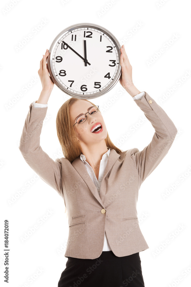 Young caucasian business woman holding clock. Young caucasian business woman holding clock.