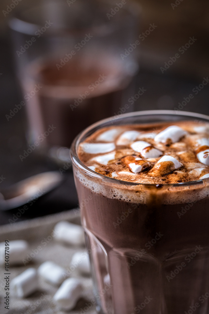 hot chocolate with small marshmallows in a glass beaker hot chocolate with small marshmallows in a glass beaker