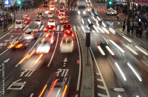 Traffic with blurred lights on the streets of Tokyo illustrating a busy, hurried concept or human population © nyker