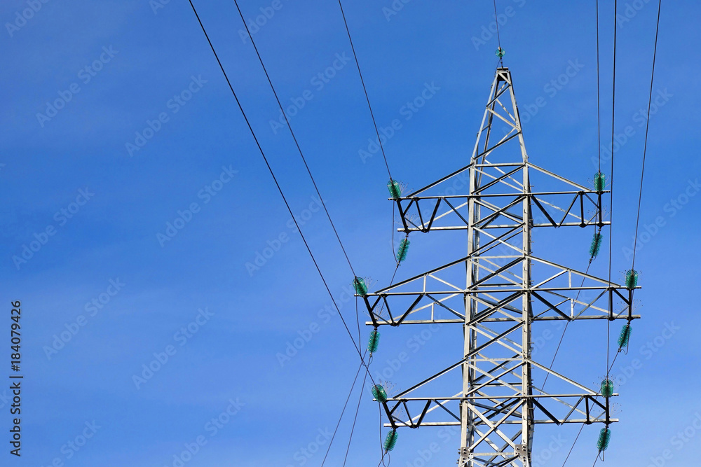 Metal power pole and wires against the sky Metal power pole and wires against the sky