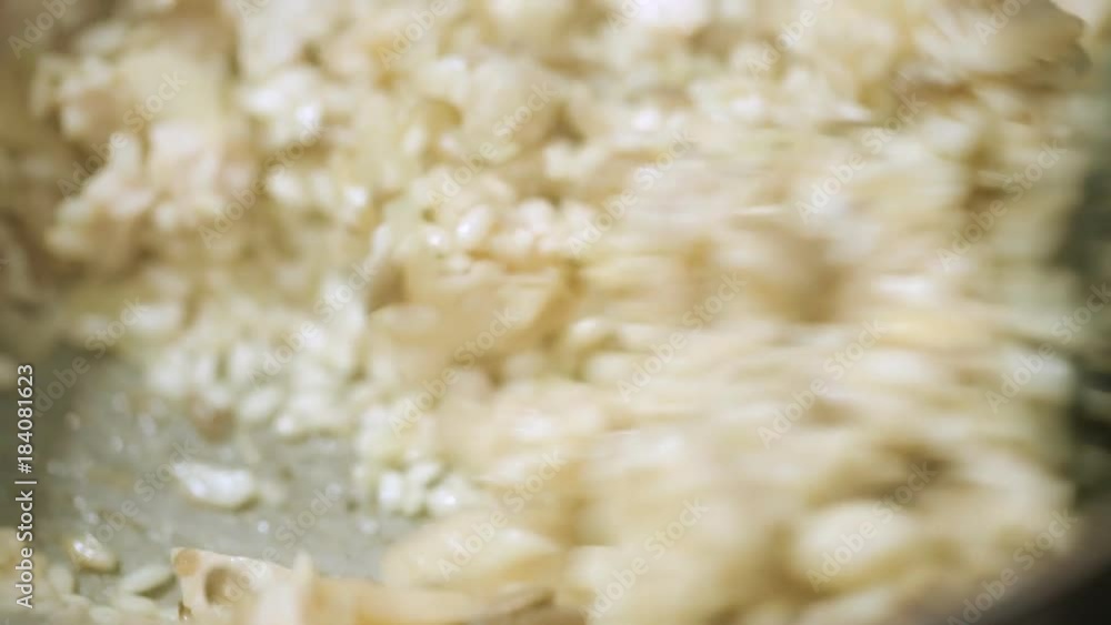 Stirring risotto in pan during cooking Stirring risotto in pan during cooking