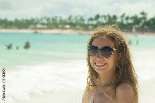 A girl on the beach in Punta Cana, Dominican Republic. © ferkhova
