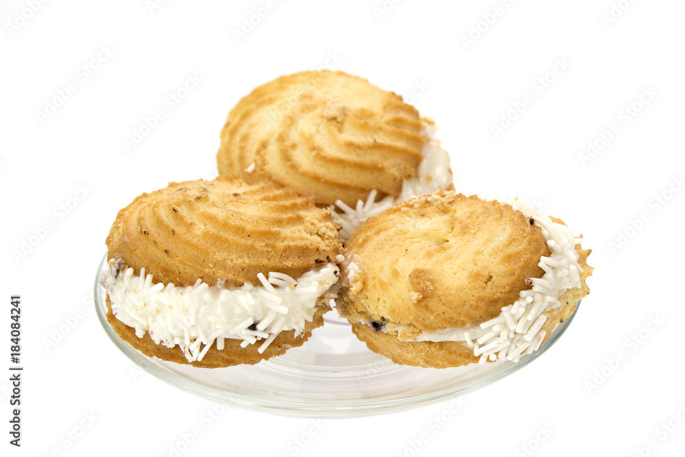 Cakes on a plate isolated on white Cakes on a plate isolated on white