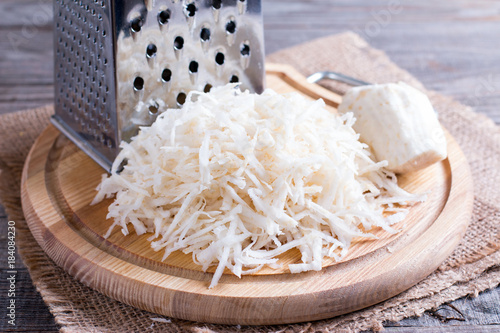 Celery root (celeriac) grated for a salad photo