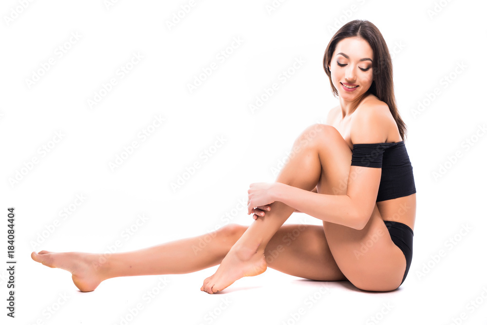 Beautiful slim body woman in good shape sport slim on floor posing isolated on white Beautiful slim body woman in good shape sport slim on floor posing isolated on white