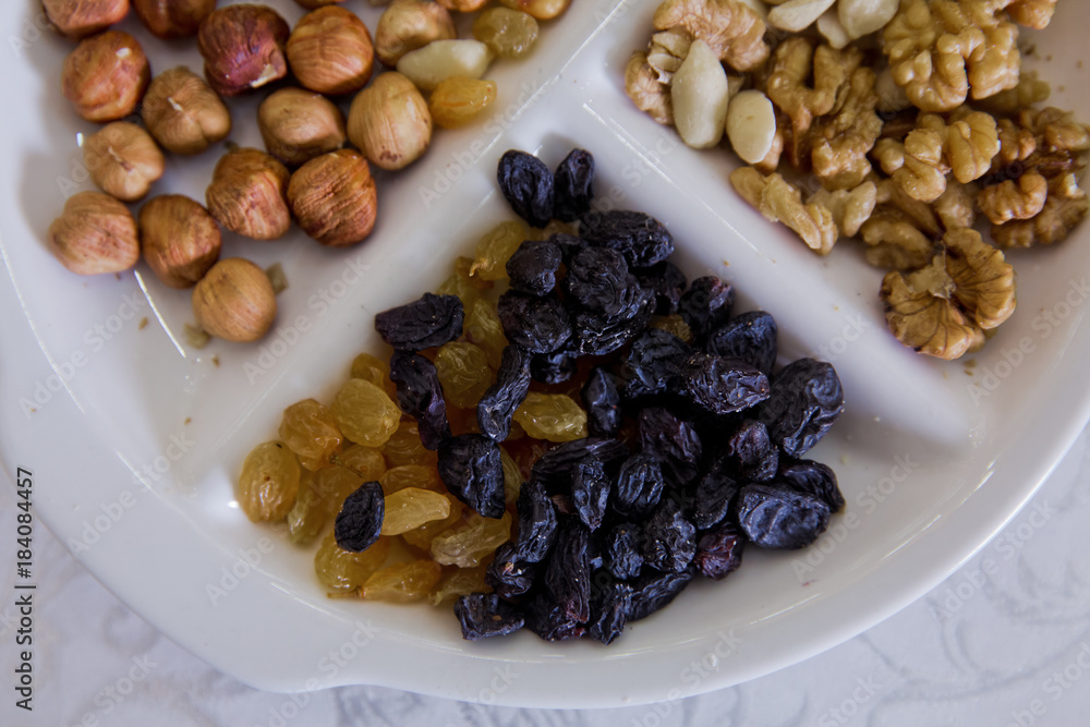 Hazelnuts, walnuts, black cheese, white raisins, nuts Hazelnuts, walnuts, black cheese, white raisins, nuts