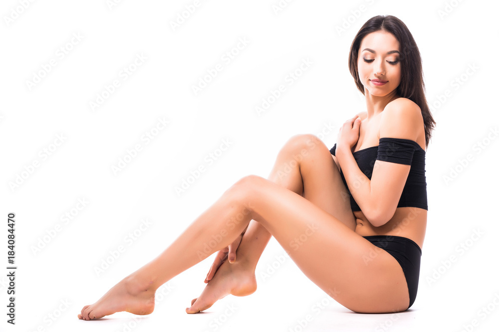 Beautiful slim body woman in good shape sport slim on floor posing isolated on white