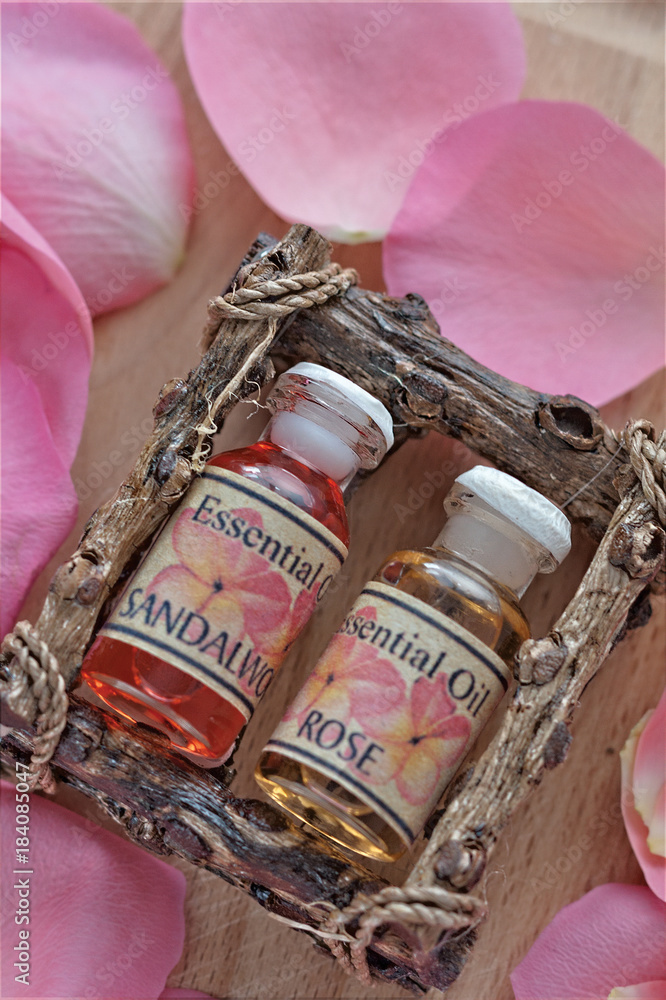 Bottles of Rose Essence with Petals