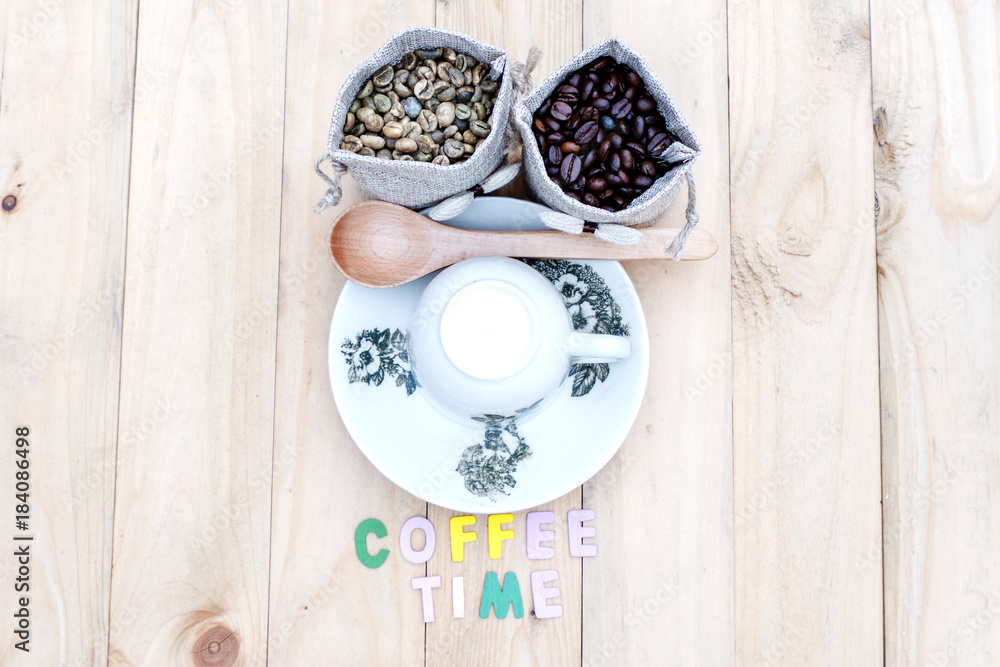 Bag of coffee beans and a cup of coffee on the table. Bag of coffee beans and a cup of coffee on the table.