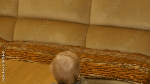 cute standing near table Infant magically disappears smooth zoom photo