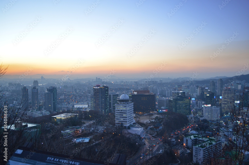 Fototapeta premium Cityscape at N Seoul Tower during the sunset. Panorama from the top of Seoul, South Korea