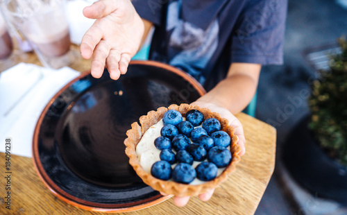 Dessert with blueberries in an edible basket