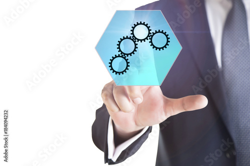 business  technology and internet concept - businessman pressing mechanism button with mechanism icon on virtual screens 