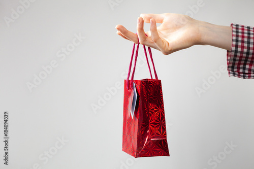 Woman holding gift shopping bag