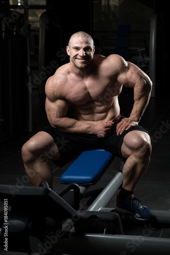 Attractive Young Man Resting In Gym Afther Exercise