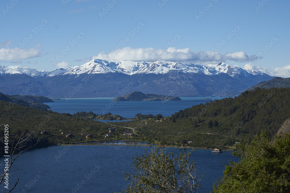 Landscape along the Carretera Austral next to the azure blue waters of Lago General Carrera in Patagonia, Chile. Lago Bertrand in the foreground. 
