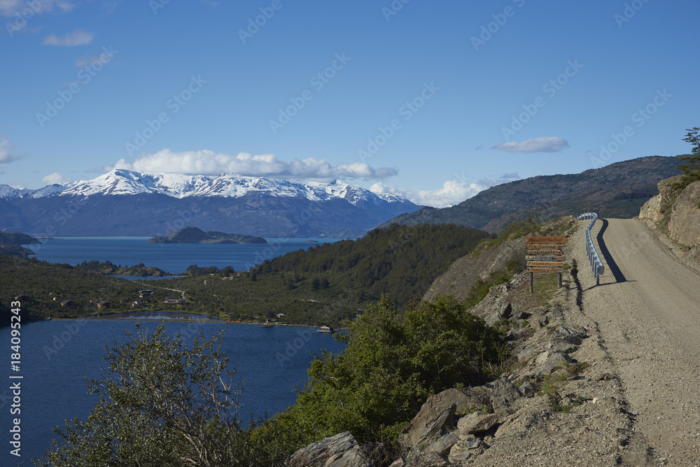 Landscape along the Carretera Austral next to the azure blue waters of Lago General Carrera in Patagonia, Chile. Lago Bertrand in the foreground. 