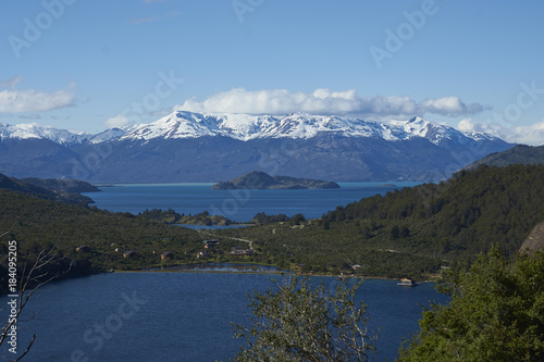 Landscape along the Carretera Austral next to the azure blue waters of Lago General Carrera in Patagonia  Chile. Lago Bertrand in the foreground. 