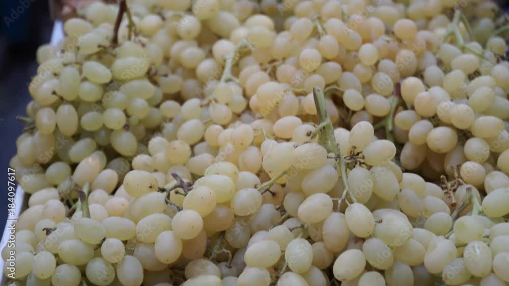 grapes on sale on the shelf in the market - oriental bazaar grapes on sale on the shelf in the market - oriental bazaar