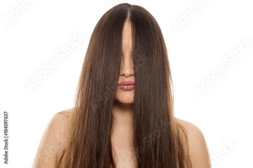 young beautiful woman with a hair over her face