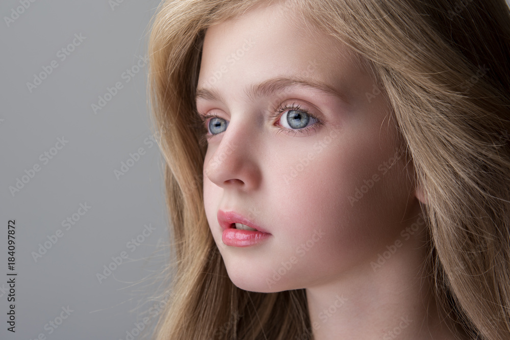 Feeling sadness. Close-up of face of adorable serious little girl is