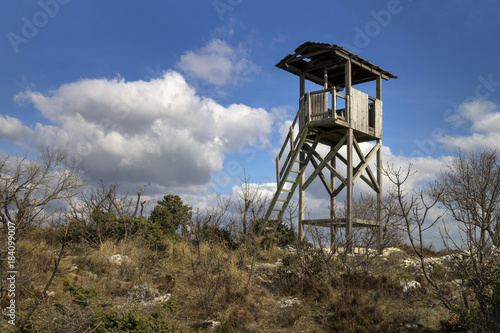 Old wooden fire protection watchtower on top of the hill Kozjak above of town Kastela in Croatia
