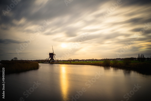 Old windmills in Kinderdijk at sunrise, Holland, Netherlands, Europe. Unesco world heritage site.