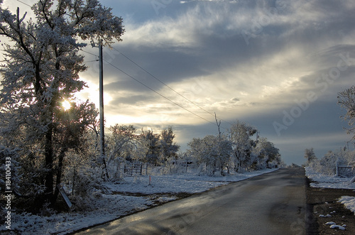 Winter snow at sunrise on a country road