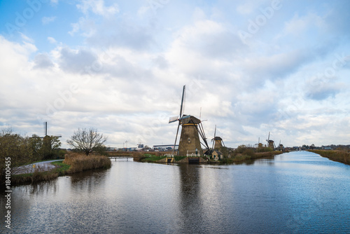Old windmills in Kinderdijk at sunrise, Holland, Netherlands, Europe. Unesco world heritage site.